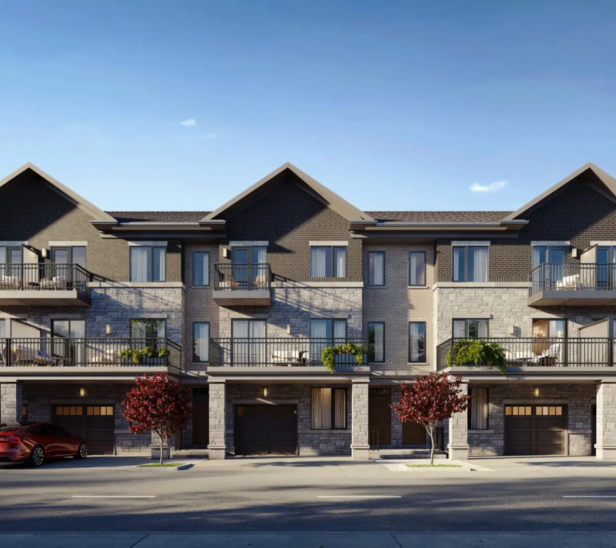 A pedestrian-friendly street within the Skylands Townhomes project, lined with trees and modern townhomes