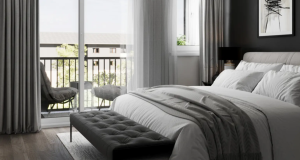Nomi Townhomes Bedroom fully decorated with view of the balcony