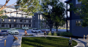 Nomi Townhomes Park View with people working out in a beautiful street with landscaped grass